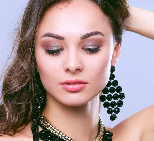 Portrait of a beautiful woman with necklace — Stock Photo, Image