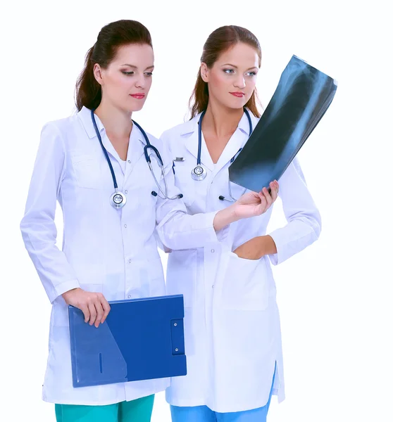 Two woman nurse watching X Ray image, standing in hospital — Stock Photo, Image