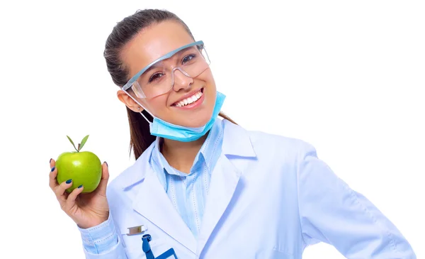Yeşil elmalı gülümseyen kadın doktor.. — Stok fotoğraf