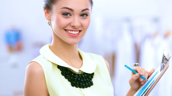 Modern young fashion designer working at studio. — Stock Photo, Image