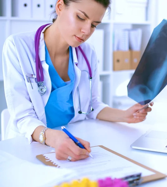 Woman researcher is surrounded by medical vials and flasks, isolated on white background — Stock Photo, Image