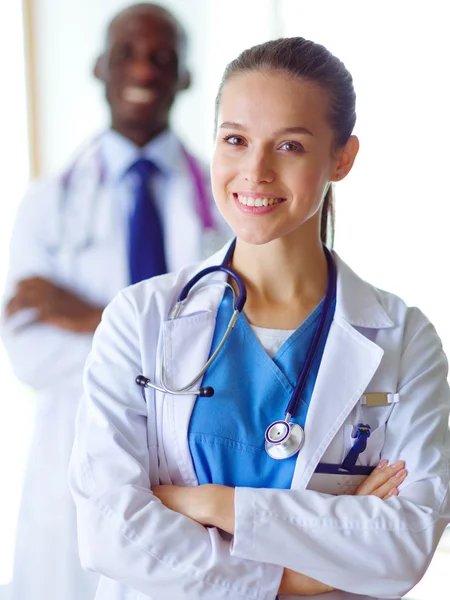 A medical team of doctors, man and woman, isolated on white background