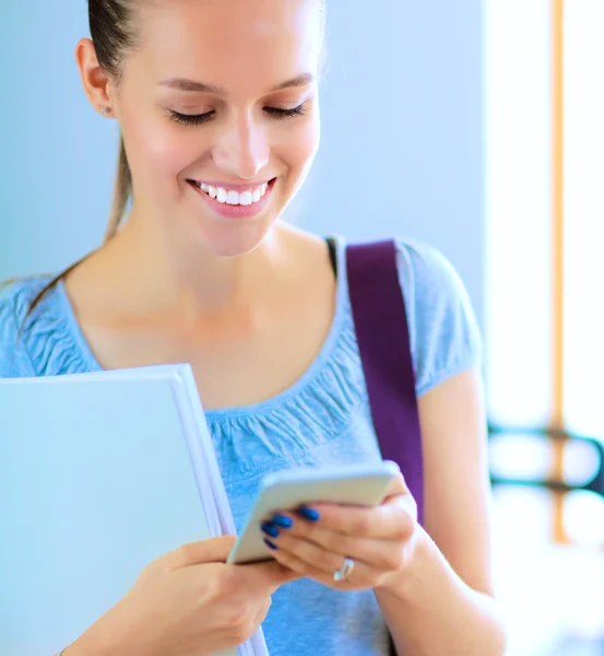 Woman use of mobile phone in university — Stock Photo, Image