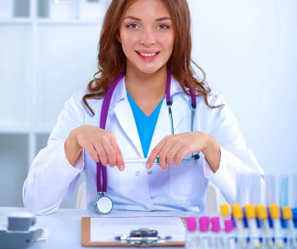 Woman researcher is surrounded by medical vials and flasks, isolated on white background — Stock Photo, Image