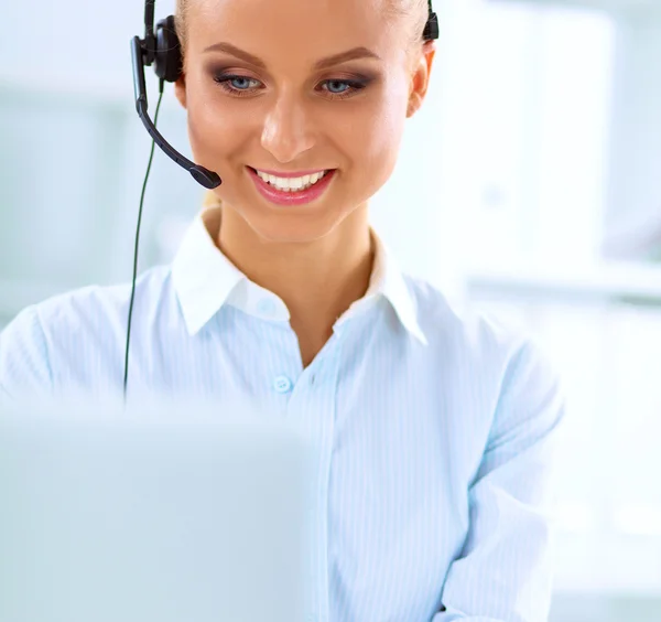 Close-up portrait of a customer service agent sitting at office — Stock Photo, Image