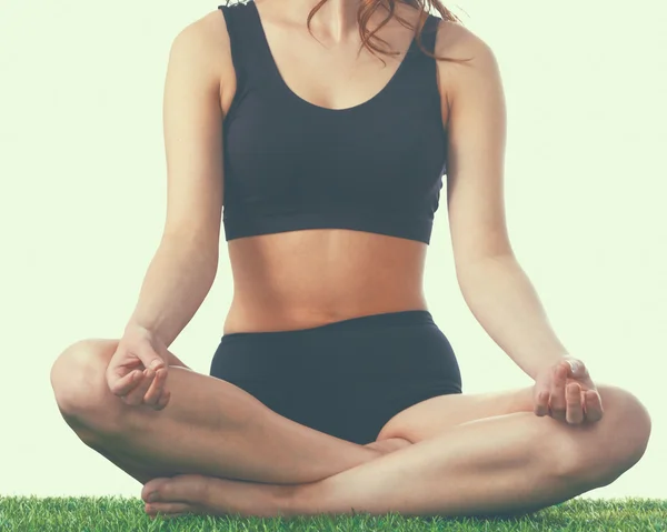 Mujer joven practicando yoga en posición de loto —  Fotos de Stock