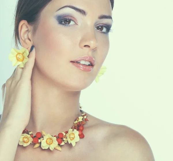 Portrait of young beautiful brunette woman in beads — Stock Photo, Image