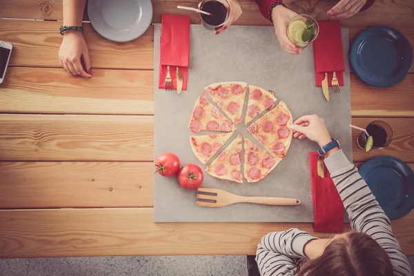 stock image Group of people eating pizza.