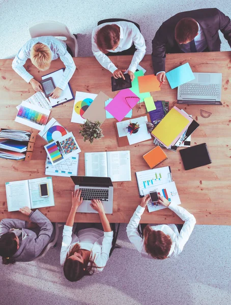 Business people sitting and discussing at business meeting, in office — Stock Photo, Image