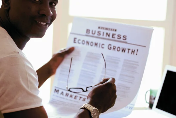 Portrait of an African American with newspaper — Stock Photo, Image