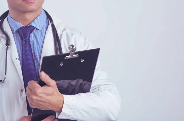 Male doctor standing with folder, isolated on white background — Stock Photo, Image