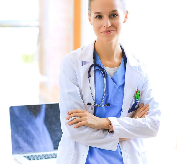 Woman doctor standing with medical stethoscope at hospital — Stock Photo, Image