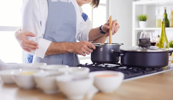 Couple cooking together in the kitchen at home — Stock Photo, Image