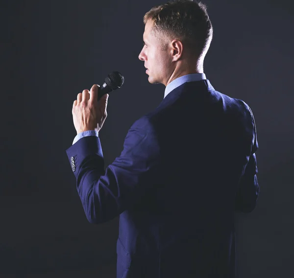 Handsome businessman is speaking on conference in hotel — Stock Photo, Image