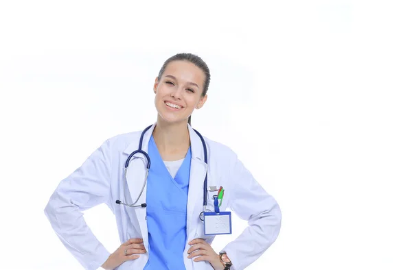 Beautiful young woman in white coat posing with hand in pocket. Woman doctor — Stock Photo, Image