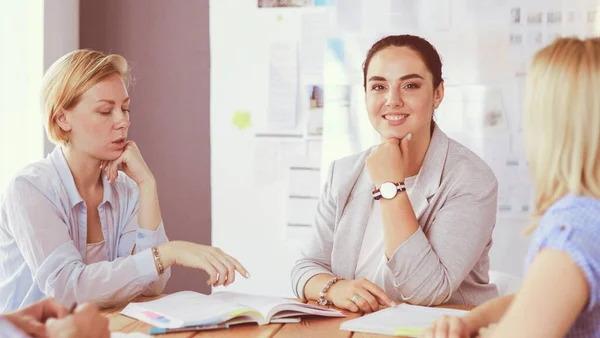 Young people studying with books on desk. Beautiful women and men working together. — Stock Photo, Image