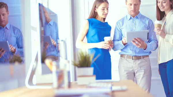 Happy businesspeople using digital tablet outside office building — Stock Photo, Image