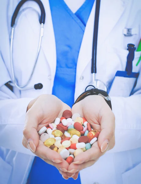 Doctor holding heap of drugs in a hand. Woman doctor — Stock Photo, Image