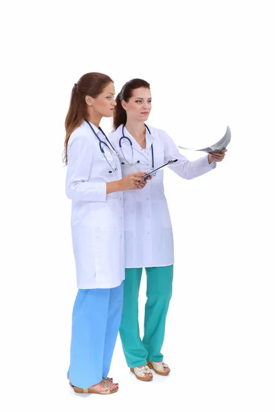 Two woman nurse watching X Ray image, standing in hospital — Stock Photo, Image