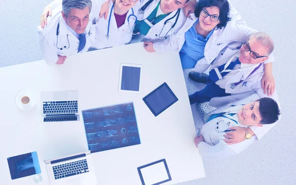 Medical team sitting and discussing at table, top view — Stock Photo, Image