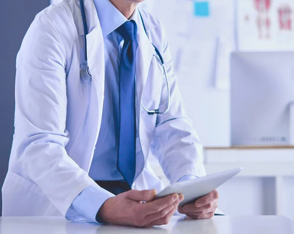 Portrait of a smiling doctor in his bright office — Stock Photo, Image