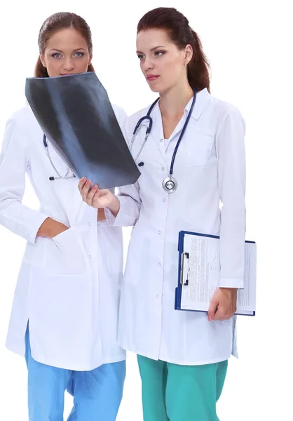 Two woman nurse watching X Ray image, standing in hospital — Stock Photo, Image