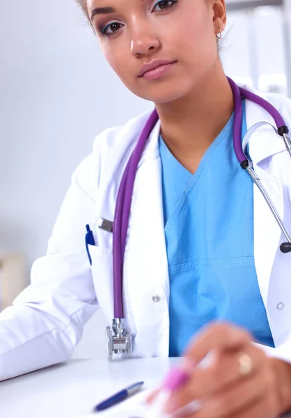 Woman researcher is surrounded by medical vials and flasks, iso — Stock Photo, Image