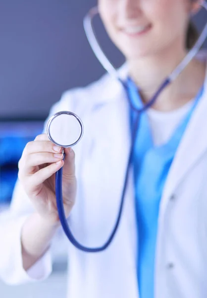 Close-up shot of doctors hands holding stethoscope at clinic. — Stock Photo, Image