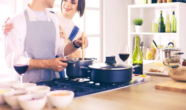 Couple cooking together in the kitchen at home — Stock Photo, Image