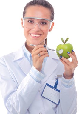 Yeşil elmalı gülümseyen kadın doktor. Kadın doktor