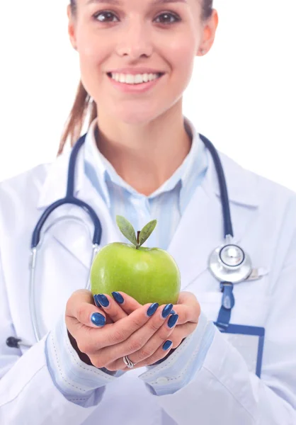 Una doctora sonriente con una manzana verde. Mujer doctora —  Fotos de Stock