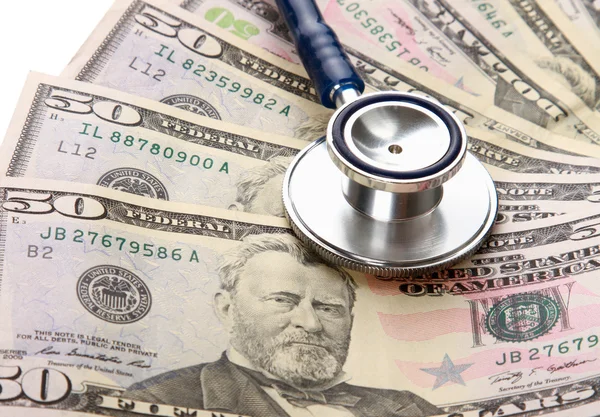 Heap of dollars with stethoscope — Stock Photo, Image
