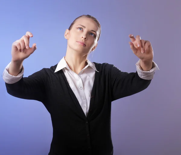 Portrait of a young woman showing something — Stock Photo, Image