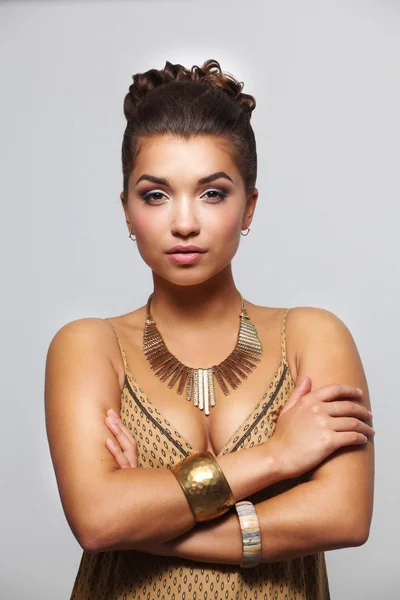 Young beautiful brunette woman with beads — Stock Photo, Image