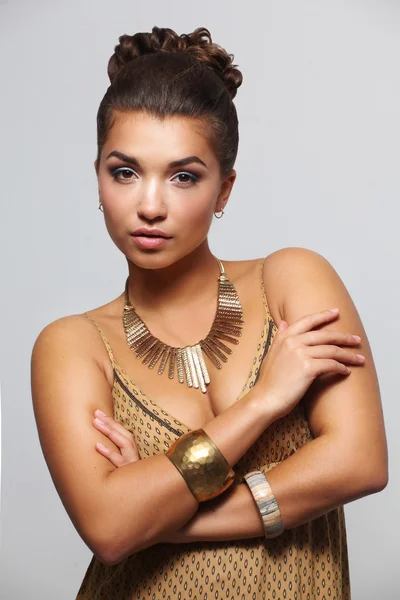 Young beautiful brunette woman with beads — Stock Photo, Image