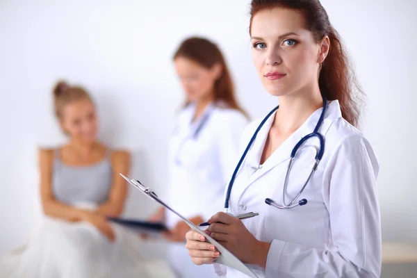 Portrait of woman doctor at hospital with folder — Stock Photo, Image