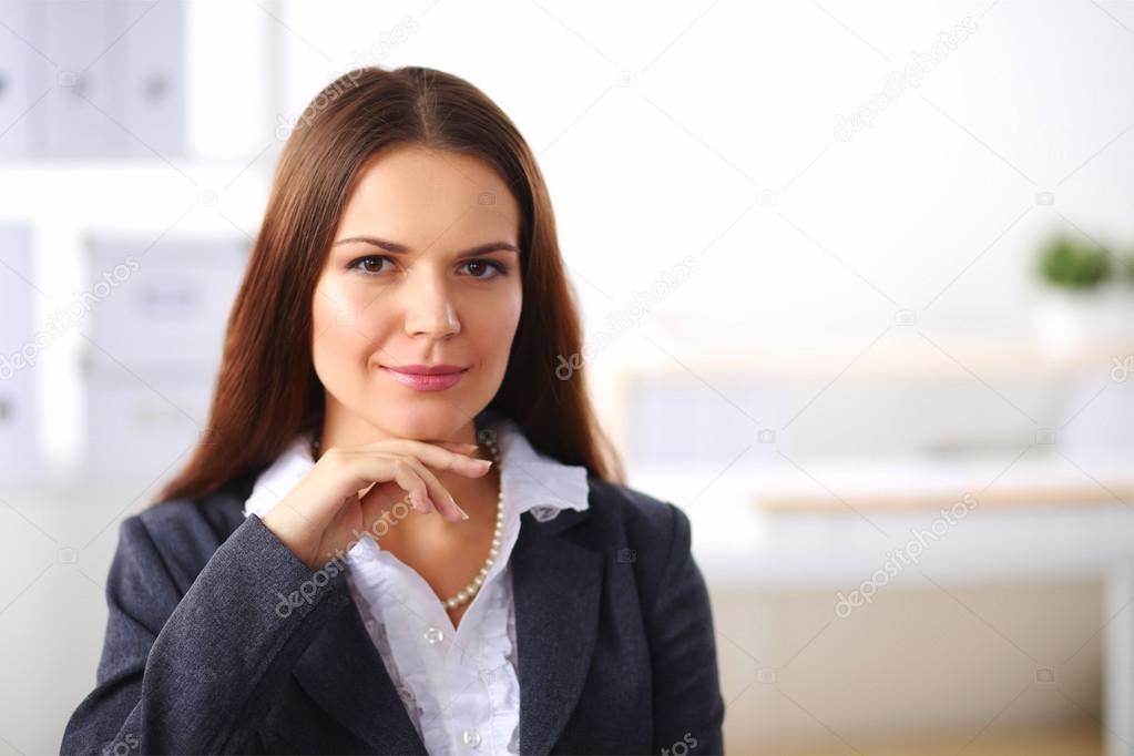Attractive businesswoman sitting  in the office