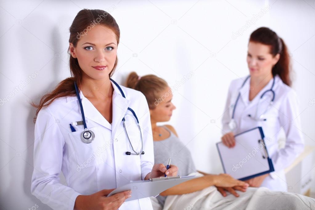Portrait of woman doctor at hospital with folder