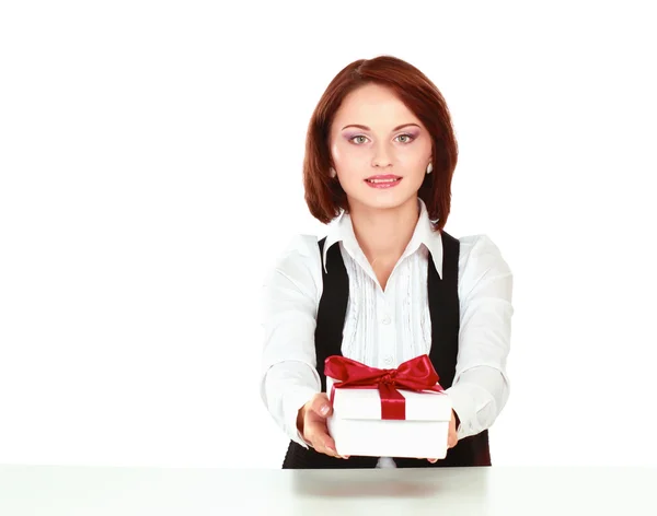 Business woman with gift box red bow sitting at the desk — Stock Photo, Image