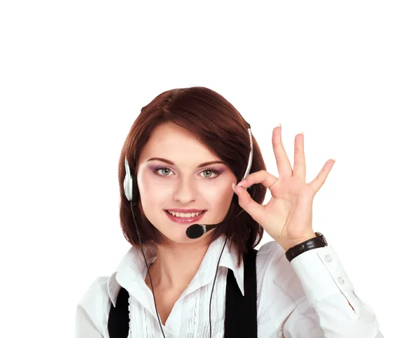 Sorrindo jovem atendimento ao cliente menina com um fone de ouvido em seu local de trabalho, close-up, isolado no fundo branco — Fotografia de Stock