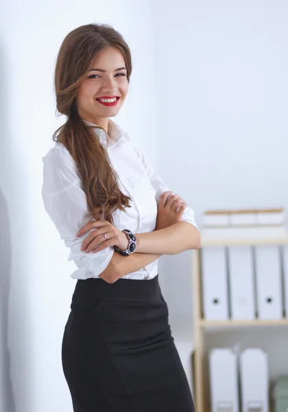 Attractive businesswoman standing in office — Stock Photo, Image