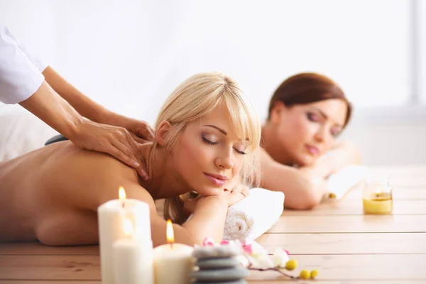 Two young beautiful women relaxing and enjoying at the spa center — Stock Photo, Image