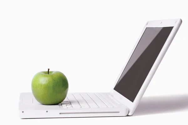 Apple on a laptop — Stock Photo, Image