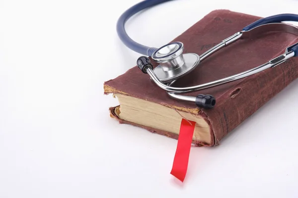 Stethoscope on a pile of books — Stock Photo, Image