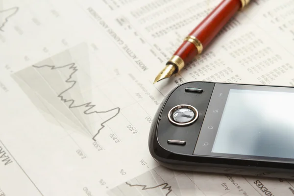 A mobile phone and a pen on papers — Stock Photo, Image