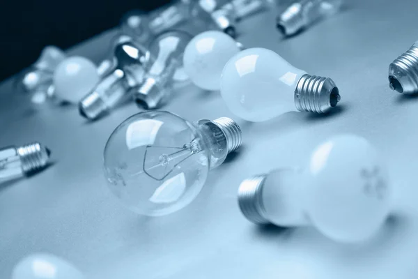 Light bulbs crowd with one shining — Stock Photo, Image