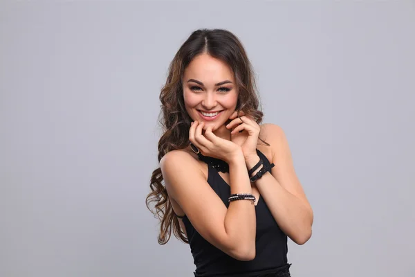 Portrait of a beautiful woman with necklace, isolated on grey background — Stock Photo, Image