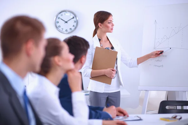 Business people sitting and discussing at business meeting, in office — Stock Photo, Image