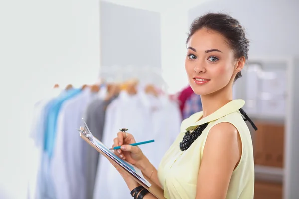 Modern young fashion designer working at studio. — Stock Photo, Image