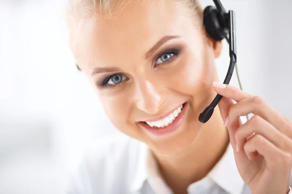 Close-up portrait of a customer service agent sitting at office — Stock Photo, Image